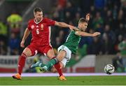 29 March 2022; Willi Orbán of Hungary and Dion Charles of Northern Ireland during the international friendly match between Northern Ireland and Hungary at National Football Stadium at Windsor Park in Belfast. Photo by Ramsey Cardy/Sportsfile