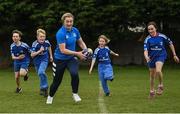 30 March 2022; In attendance at the launch of Leinster Rugby Summer Camps is Ali Coleman of Leinster, centre, with, from left, Kaleb McCallister, aged 12, James Mullrooney, aged 10, Fiadh Bel Molloy, aged 9, and Holly O'Dell, aged 11,  at St Mary's College RFC in Dublin. Photo by Sam Barnes/Sportsfile