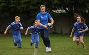 30 March 2022; In attendance at the launch of Leinster Rugby Summer Camps is Ali Coleman of Leinster, second from left, with, from left, James Mullrooney, aged 10, Fiadh Bel Molloy, aged 9, and Holly O'Dell, aged 11,  at St Mary's College RFC in Dublin. Photo by Sam Barnes/Sportsfile