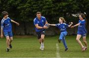 30 March 2022; In attendance at the launch of Leinster Rugby Summer Camps is Jordan Larmour of Leinster, centre, with, from left, Kaleb McCallister, aged 12, Fiadh Bel Molloy, aged 9, and Holly O'Dell, aged 11,  at St Mary's College RFC in Dublin. Photo by Sam Barnes/Sportsfile