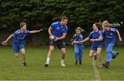 30 March 2022; In attendance at the launch of Leinster Rugby Summer Camps is Jordan Larmour of Leinster, centre, with, from left, Kaleb McCallister, aged 12, Fiadh Bel Molloy, aged 9, Holly O'Dell, aged 11, and  James Mullrooney, aged 10,  at St Mary's College RFC in Dublin. Photo by Sam Barnes/Sportsfile