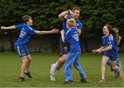 30 March 2022; In attendance at the launch of Leinster Rugby Summer Camps is Jordan Larmour of Leinster, centre, with, from left, Kaleb McCallister, aged 12, James Mullrooney, aged 10, Fiadh Bel Molloy, aged 9, and Holly O'Dell, aged 11,  at St Mary's College RFC in Dublin. Photo by Sam Barnes/Sportsfile