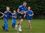 30 March 2022; In attendance at the launch of Leinster Rugby Summer Camps is Jordan Larmour of Leinster, centre, with, from left, James Mullrooney, aged 10, Fiadh Bel Molloy, aged 9, and Holly O'Dell, aged 11,  at St Mary's College RFC in Dublin. Photo by Sam Barnes/Sportsfile