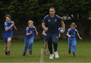 30 March 2022; In attendance at the launch of Leinster Rugby Summer Camps is James Lowe of Leinster, second from right, with, from left, Kaleb McCallister, aged 12, James Mullrooney, aged 11 and Fiadh Bel Molloy, aged 9, at St Mary's College RFC in Dublin. Photo by Sam Barnes/Sportsfile