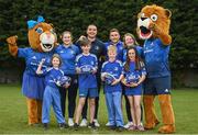 30 March 2022; In attendance at the launch of Leinster Rugby Summer Camps are, backrow from left, mascot Leona the Lioness, Leinster players Ali Coleman, James Lowe, Jordan Larmour and Aoife Wafer, and mascot Leo the Lion, with front row, from left, Fiadh Bel Molloy, Kaleb McCallister, aged 12, aged 9, James Mullrooney, aged 10, and Holly O'Dell, aged 11 at St Mary's College RFC in Dublin. Photo by Sam Barnes/Sportsfile