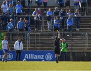27 March 2022; Referee Noel Mooney issues a yellow card to Maor Uisce and Monaghan kitman Francis McGinnity during the Allianz Football League Division 1 match between Monaghan and Dublin at St Tiernach's Park in Clones, Monaghan. Photo by Ray McManus/Sportsfile