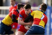 31 March 2022; Andrew Tonge  of Catholic University School is tackled by Nathan Clarke, left, and Matthew Linehan  of St Fintans High School during the Bank of Ireland Vinnie Murray Cup Final match between St Fintan's High School and Catholic University School at Energia Park in Dublin. Photo by Harry Murphy/Sportsfile