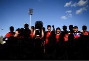 31 March 2022; Harry Lynch  of Catholic University School lifts the trophy with teammates after the Bank of Ireland Vinnie Murray Cup Final match between St Fintan's High School and Catholic University School at Energia Park in Dublin. Photo by Harry Murphy/Sportsfile