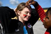 1 April 2022; Sacred Heart Secondary supporter Beibhínn Murphy has colours painted on her face by Anne Ngwenya before the Lidl All Ireland Post Primary Schools Senior ‘C’ Championship Final match between Our Lady's Bower, Athlone, Westmeath and Sacred Heart Secondary, Clonakilty, Cork at Sean Treacy Park in Tipperary Town. Photo by Ray McManus/Sportsfile