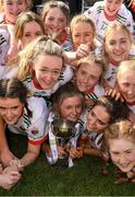 1 April 2022; Sacred Heart Secondary captain Lydia Sutton, and her team mates celebrate after she had lifted the cup after the Lidl All Ireland Post Primary Schools Senior ‘C’ Championship Final match between Our Lady's Bower, Athlone, Westmeath and Sacred Heart Secondary, Clonakilty, Cork at Sean Treacy Park in Tipperary Town. Photo by Ray McManus/Sportsfile