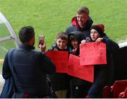 1 April 2022; Chris Forrester of St Patrick's Athletic poses for a picture with young supporters before the SSE Airtricity League Premier Division match between St Patrick's Athletic and Drogheda United at Richmond Park in Dublin. Photo by Michael P Ryan/Sportsfile