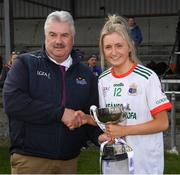 1 April 2022; Sacred Heart Secondary captain Lydia Sutton is presented with the cup by Robbie Smith, Munster LGFA President and Vice President of the Ladies Gaelic Football Association after the Lidl All Ireland Post Primary Schools Senior ‘C’ Championship Final match between Our Lady's Bower, Athlone, Westmeath and Sacred Heart Secondary, Clonakilty, Cork at Sean Treacy Park in Tipperary Town. Photo by Ray McManus/Sportsfile