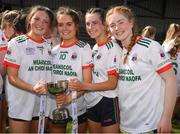 1 April 2022; Maeve Kingston, 7, Roisin Ni Bhuacalla, centre, and Aisling Moloney, 15, and Eimear O'Brien of Sacred Heart Secondary with the cup after the Lidl All Ireland Post Primary Schools Senior ‘C’ Championship Final match between Our Lady's Bower, Athlone, Westmeath and Sacred Heart Secondary, Clonakilty, Cork at Sean Treacy Park in Tipperary Town. Photo by Ray McManus/Sportsfile