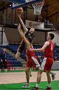 2 April 2022; Matthew McHale of Sligo All-Stars goes up for a basket over Stepan Letsko of Templeogue BC during the InsureMyVan.ie Men’s U20 National League Plate Final match between Sligo All-Stars and Templeogue BC, Dublin, at the National Basketball Arena in Dublin. Photo by Brendan Moran/Sportsfile