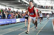2 April 2022; Robert Carney of Ballyskenach AC, Offaly, crosses the line to win the boys U17 4x200m relay during day three of the Irish Life Health National Juvenile Indoor Championships at TUS International Arena in Athlone, Westmeath. Photo by Sam Barnes/Sportsfile