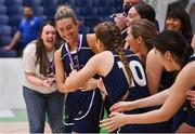 2 April 2022; Lexi Posset of Ulster University is congratulated by her teammates after being named MVP after the MissQuote.ie Division 1 League Cup Final match between NUIG Mystics, Galway and Ulster University, Antrim, at the National Basketball Arena in Dublin. Photo by Brendan Moran/Sportsfile