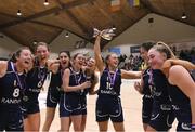 2 April 2022; Ulster University captain Aoife Callaghan and teammates celebrate with the cup after the MissQuote.ie Division 1 League Cup Final match between NUIG Mystics, Galway and Ulster University, Antrim, at the National Basketball Arena in Dublin. Photo by Daniel Tutty/Sportsfile