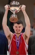 2 April 2022; UCC Demons captain Ryan Murphy lifts the cup after the InsureMyVan.ie Division 1 Final match between EJ Sligo All-Stars and UCC Demons, Cork at the National Basketball Arena in Dublin. Photo by Brendan Moran/Sportsfile