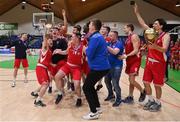 2 April 2022; UCC Demons captain Ryan Murphy and his teammates celebrate with the cup after the InsureMyVan.ie Division 1 Final match between EJ Sligo All-Stars and UCC Demons, Cork at the National Basketball Arena in Dublin. Photo by Brendan Moran/Sportsfile