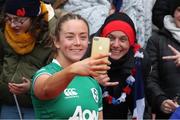 2 April 2022; Stacey Flood of Ireland take a selfie with French supporters after the TikTok Women's Six Nations Rugby Championship match between France and Ireland at Stade Ernest Wallon in Toulouse, France. Photo by Manuel Blondeau/Sportsfile
