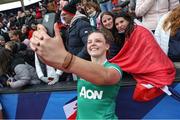 2 April 2022; Brittany Hogan of Ireland take a selfie with French supporters after the TikTok Women's Six Nations Rugby Championship match between France and Ireland at Stade Ernest Wallon in Toulouse, France. Photo by Manuel Blondeau/Sportsfile