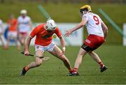 2 April 2022; Shea Gaffney of Armagh in action against Conor Grogan of Tyrone during the Allianz Hurling League Division 3A Final match between Tyrone and Armagh at Derry GAA Centre of Excellence in Owenbeg, Derry. Photo by Oliver McVeigh/Sportsfile