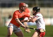 2 April 2022; Ruairi Slane of Tyrone in action against Kieran McKernan of Armagh during the Allianz Hurling League Division 3A Final match between Tyrone and Armagh at Derry GAA Centre of Excellence in Owenbeg, Derry. Photo by Oliver McVeigh/Sportsfile