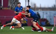 2 April 2022; James Lowe of Leinster is tackled by Damian De Allende and Calvin Nash of Munster during the United Rugby Championship match between Munster and Leinster at Thomond Park in Limerick. Photo by Harry Murphy/Sportsfile