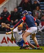 2 April 2022; Jack Prendergast of Waterford is tackled by Cork goalkeeper Patrick Collins during the Allianz Hurling League Division 1 Final match between Cork and Waterford at FBD Semple Stadium in Thurles, Tipperary. Photo by Eóin Noonan/Sportsfile