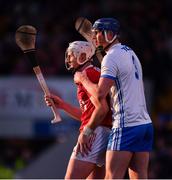 2 April 2022; Conor Prunty of Waterford keeps a close eye on Patrick Horgan of Cork as the sun sets in the distance during the Allianz Hurling League Division 1 Final match between Cork and Waterford at FBD Semple Stadium in Thurles, Tipperary. Photo by Ray McManus/Sportsfile