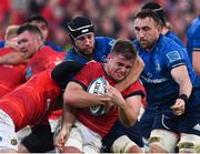 2 April 2022; Alex Kendellen of Munster is tackled by Caelan Doris and Jack Conan of Leinster during the United Rugby Championship match between Munster and Leinster at Thomond Park in Limerick. Photo by Harry Murphy/Sportsfile