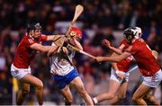 2 April 2022; Carthach Daly of Waterford is tackled by Darragh Fitzgibbon, left, and Ger Millerick of Cork during the Allianz Hurling League Division 1 Final match between Cork and Waterford at FBD Semple Stadium in Thurles, Tipperary. Photo by Ray McManus/Sportsfile