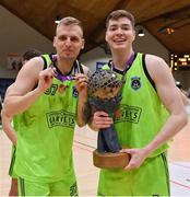 2 April 2022; Ronalds Elksnis, left, and Keelan Crowe of Garvey's Tralee Warriors celebrate with the Superleague trophy after the InsureMyVan.ie SuperLeague Final match between Garvey’s Tralee Warriors, Kerry and C&S Neptune, Cork, at the National Basketball Arena in Dublin. Photo by Brendan Moran/Sportsfile