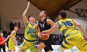 3 April 2022; Brendan Doulana of Quish's Ballincollig in action against Paraic Moran, left, and Sotiris Miltiadis of UCD Marian during the InsureMyVan.ie U20 Men’s National League Final match between Quish's Ballincollig, Cork and UCD Marian, Dublin at the National Basketball Arena in Dublin. Photo by Brendan Moran/Sportsfile