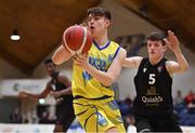 3 April 2022; Paraic Moran of UCD Marian in action against Rory O'Flynn of Quish's Ballincollig during the InsureMyVan.ie U20 Men’s National League Final match between Quish's Ballincollig, Cork and UCD Marian, Dublin at the National Basketball Arena in Dublin. Photo by Brendan Moran/Sportsfile