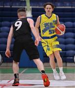 3 April 2022; Eoin Fitzgerald of UCD Marian in action against Sean O'Flynn of Quish's Ballincollig during the InsureMyVan.ie U20 Men’s National League Final match between Quish's Ballincollig, Cork and UCD Marian, Dublin at the National Basketball Arena in Dublin. Photo by Brendan Moran/Sportsfile