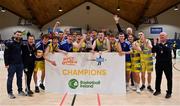 3 April 2022; The UCD Marian team celebrate with the cup after the InsureMyVan.ie U20 Men’s National League Final match between Quish's Ballincollig, Cork and UCD Marian, Dublin at the National Basketball Arena in Dublin. Photo by Brendan Moran/Sportsfile