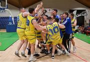 3 April 2022; The UCD Marian team celebrate with the cup after the InsureMyVan.ie U20 Men’s National League Final match between Quish's Ballincollig, Cork and UCD Marian, Dublin at the National Basketball Arena in Dublin. Photo by Brendan Moran/Sportsfile