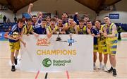 3 April 2022; The UCD Marian team celebrate with the cup after the InsureMyVan.ie U20 Men’s National League Final match between Quish's Ballincollig, Cork and UCD Marian, Dublin at the National Basketball Arena in Dublin. Photo by Brendan Moran/Sportsfile