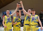3 April 2022; UCD Marian joint captains, from left, Ronan Byrne, Brian O'Hara Duggan, Luke Gilleran and Paraic Moran celebrate with the cup after the InsureMyVan.ie U20 Men’s National League Final match between Quish's Ballincollig, Cork and UCD Marian, Dublin at the National Basketball Arena in Dublin. Photo by Brendan Moran/Sportsfile