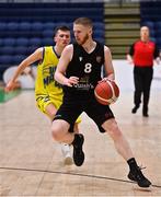 3 April 2022; Cillian O'Connell of Quish's Ballincollig in action against Conor Walsh of UCD Marian during the InsureMyVan.ie U20 Men’s National League Final match between Quish's Ballincollig, Cork and UCD Marian, Dublin at the National Basketball Arena in Dublin. Photo by Brendan Moran/Sportsfile