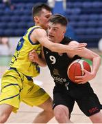 3 April 2022; Sean O'Flynn of Quish's Ballincollig in action against Conor Walsh of UCD Marian during the InsureMyVan.ie U20 Men’s National League Final match between Quish's Ballincollig, Cork and UCD Marian, Dublin at the National Basketball Arena in Dublin. Photo by Brendan Moran/Sportsfile