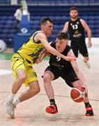 3 April 2022; Sean O'Flynn of Quish's Ballincollig in action against Conor Walsh of UCD Marian during the InsureMyVan.ie U20 Men’s National League Final match between Quish's Ballincollig, Cork and UCD Marian, Dublin at the National Basketball Arena in Dublin. Photo by Brendan Moran/Sportsfile