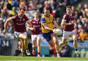 3 April 2022; Ultan Harney of Roscommon in action against Paul Conroy, 9, and Johnny Heaney of Galway as he has a shot on goal during the Allianz Football League Division 2 Final match between Roscommon and Galway at Croke Park in Dublin. Photo by Ray McManus/Sportsfile