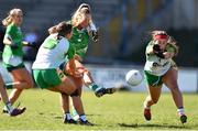 3 April 2022; Catriona Davis of Limerick has a shot on goal despite the attention of Becky Bryant, right, and Annie Kehoe of Offaly during the Lidl Ladies Football National League Division 4 Final match between Limerick and Offaly at St Brendan's Park in Birr, Offaly. Photo by Ben McShane/Sportsfile