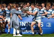 3 April 2022; Blackrock College captain Gus McCarthy is presented the cup from his mother Tara McCarthy after the Bank of Ireland Leinster Rugby Schools Senior Cup Final match between Gonzaga College and Blackrock College at the RDS Arena in Dublin. Photo by Harry Murphy/Sportsfile
