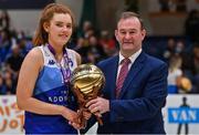 2 April 2022; Claire Melia of The Address UCC Glanmire is presented with the MVP by Basketball Ireland chief executive John Feehan after the MissQuote.ie Champions Trophy Final match between The Address UCC Glanmire, Cork and Singleton SuperValu Brunell, Cork, at the National Basketball Arena in Dublin. Photo by Brendan Moran/Sportsfile