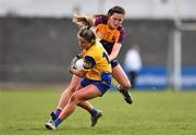 3 April 2022; Niamh Feeney of Roscommon is tackled by Clara Donnelly of Wexford during the Lidl Ladies Football National League Division 3 Final match between Roscommon and Wexford at St Brendan's Park in Birr, Offaly. Photo by Ben McShane/Sportsfile