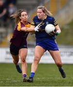 3 April 2022; Roscommon goalkeeper Helena Cummins is tackled by Aisling Murphy of Wexford during the Lidl Ladies Football National League Division 3 Final match between Roscommon and Wexford at St Brendan's Park in Birr, Offaly. Photo by Ben McShane/Sportsfile
