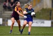 3 April 2022; Roscommon goalkeeper Helena Cummins is tackled by Aisling Murphy of Wexford during the Lidl Ladies Football National League Division 3 Final match between Roscommon and Wexford at St Brendan's Park in Birr, Offaly. Photo by Ben McShane/Sportsfile